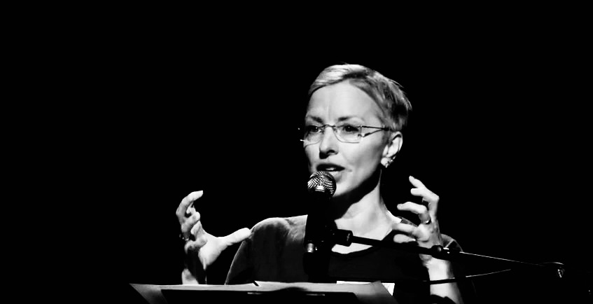 Dana Caspersen giving a talk: how to start an epidemic of non-violence.